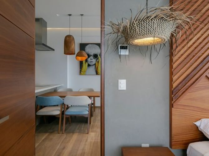 El Cielo apartment doorway looking into dining area with warm pendant lighting